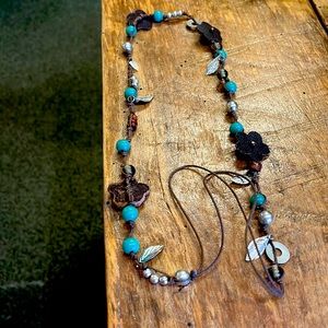 Leather necklace with silver and turquoise like detail